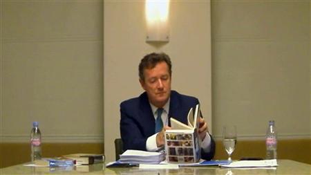 CNN's Morgan denies phone hacking in testy appearance