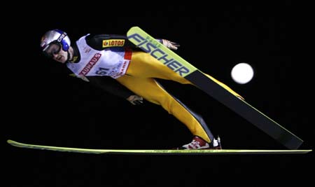 Poland's Adam Malysz soars through the air during the trial jump of the normal hill HS 100 ski jumping competition at the Nordic World Ski Championships in Sapporo, northern Japan March 2, 2007.