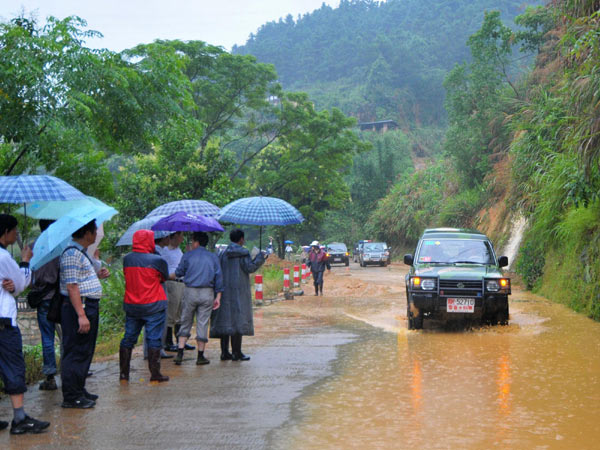 24 missing after landslides engulf vehicles