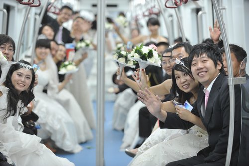 Couples say ‘I do’ in subway wedding