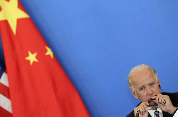 Xi, Biden talk business issues in Beijing