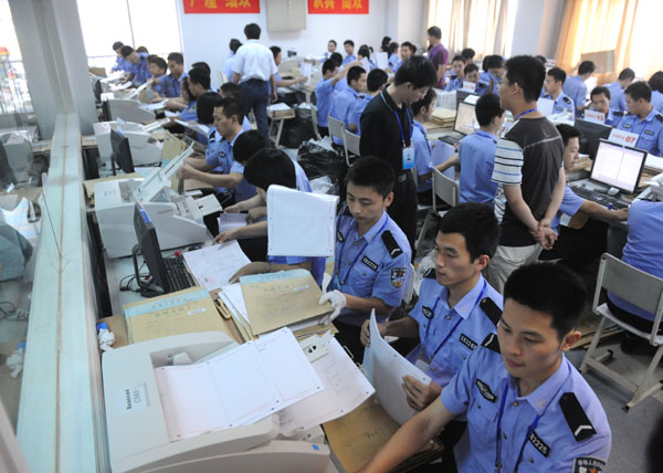 Police officials scan 2.7m exam papers