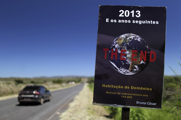 A sign announcing the end of the world is seen along a road leading into the city of Alto Paraiso de Goias, central Brazil, Dec 20, 2012. Mayan doomsday prophecy debunked