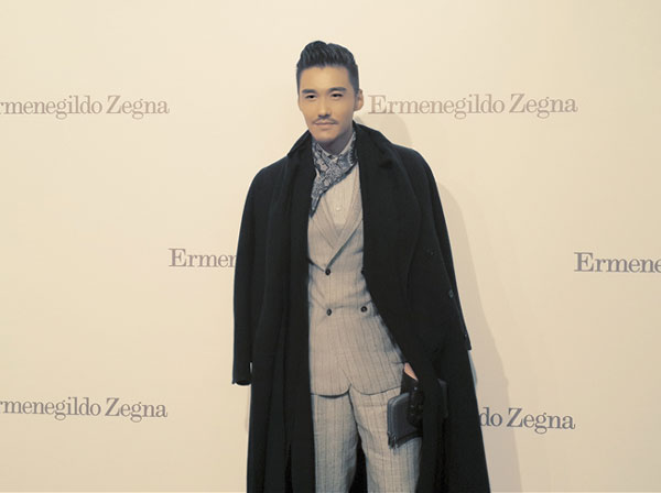 Actor Hu Bing poses at Milan Fashion Week