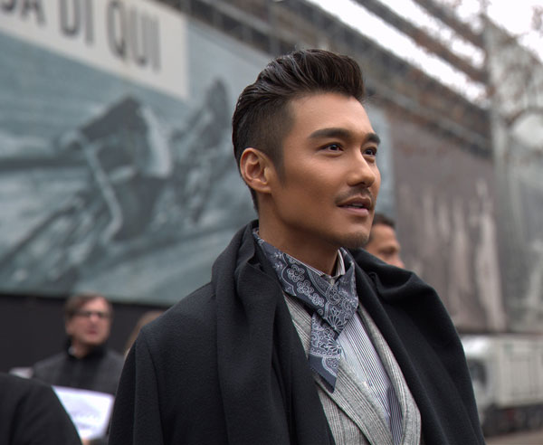 Actor Hu Bing poses at Milan Fashion Week