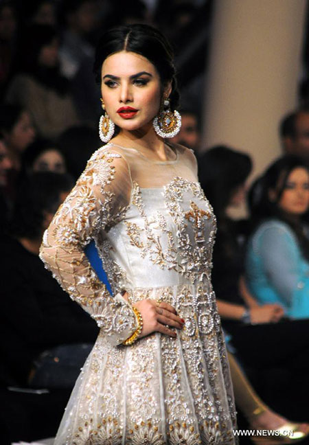 Models present creations at Bridal Couture Fashion Week