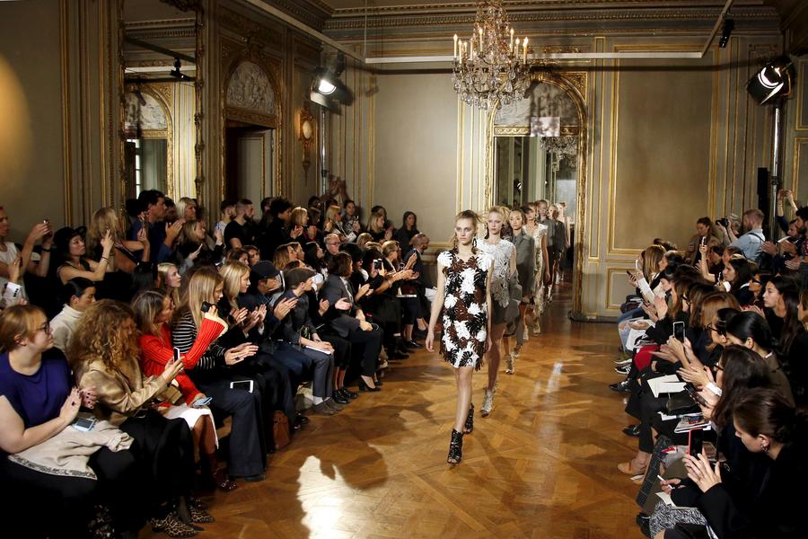 Models present creations during Paris Fashion Week