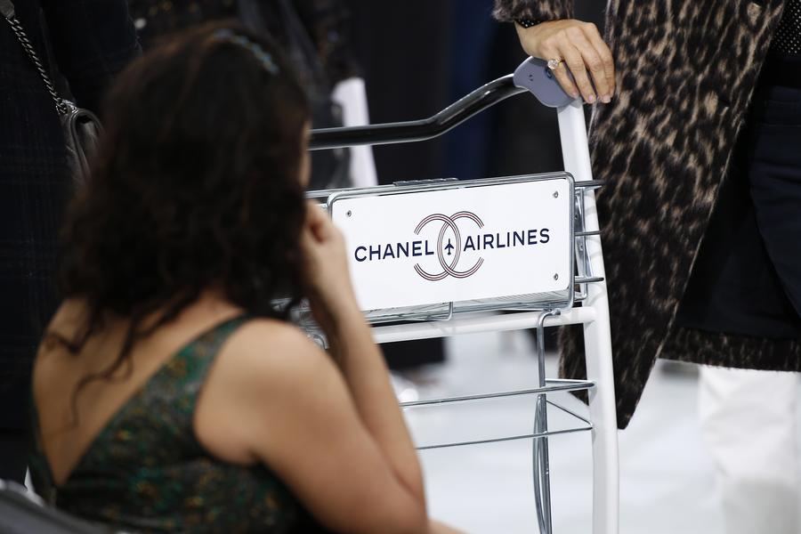 All aboard Chanel Airways as Lagerfeld's imagination takes flight