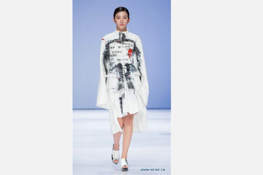 Models show creations at fashion week of institute in Beijing
