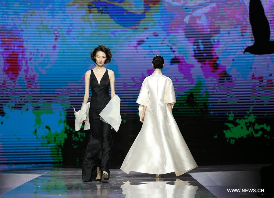 Models display Grace Chen's creations in Beijing