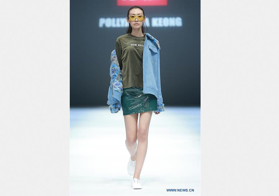 Models present creations of Jiang Yueyin at China Fashion Week
