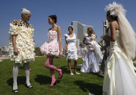 Israeli models display wedding dresses made mostly from toilet paper in Tel 