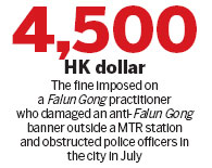 Falun Gong member fined for criminal damage