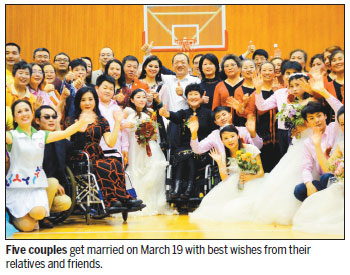 Disabled residents enjoy group wedding, supporting activities