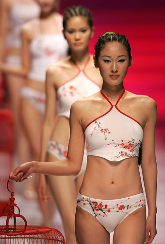 Chinese models present creations for HOSA China Lingerie Fashion Trend Collection 2006-2007 at the 14th China International Fashion Week in Beijing April 1, 2006. 