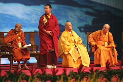 Gyaltsen Norbu (2nd-L), known as the Panchen Lama, attends the opening ceremony of the World Buddhist Forum with other Buddhist leaders including Grantha Visarada Rajakiya Pandita (L), supreme prelate of Sri Lanka, in Hangzhou, Zhejiang province in east China April 13, 2006. 