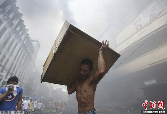 菲律宾首都购物中心发生火灾 起火原因尚未确定