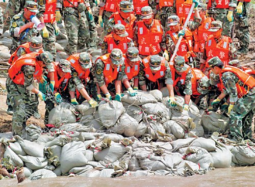 China braces for more floods as downpours continue