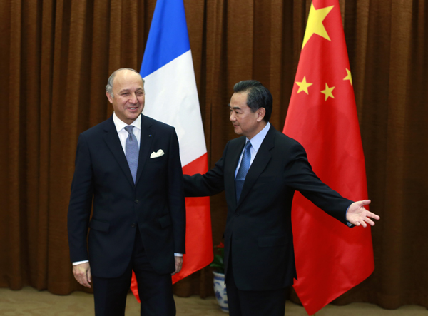 Xi urges close relations with France