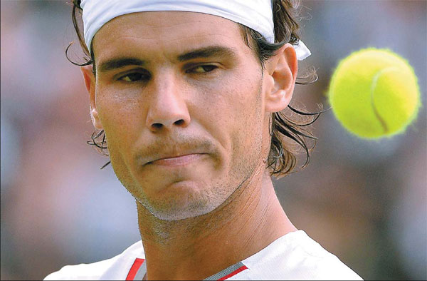 Hobbled Nadal clings onto Wimbledon dream
