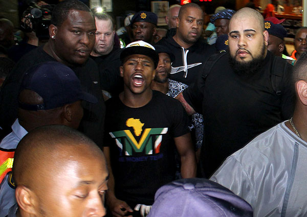 floyd mayweather center is mobbed by fans and media on his arrival in 