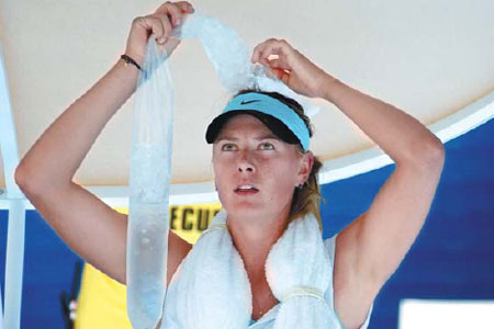 maria sharapova holds ice on her head during her match against karin