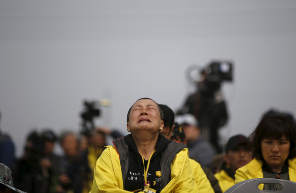 A Mother Of A Victim Who Was Aboard The Sunken Ferry Sewol Cries At A Memorial Ceremony Ahead Of The