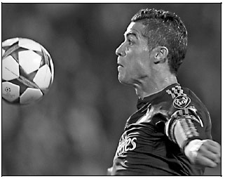 History-maker Ronaldo happy at Real - for now