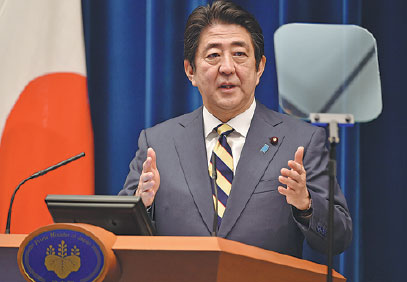 Abe declares summit with Putin needed to resolve territorial row