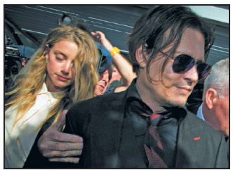 Actor Johnny Depp's wife walks free in dog smuggling debacle
