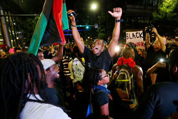 A Man Shouts At The Intersection Of Trade And College