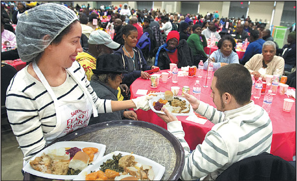 Volunteers Serve A Traditional Thanksgiving Meal To More