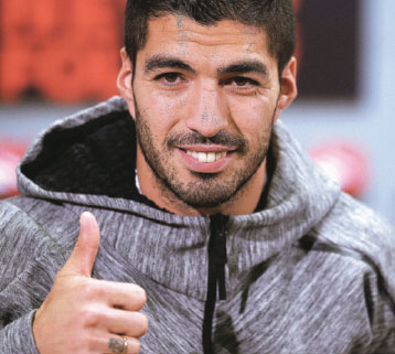 Barca locks up red-hot Suarez with massive 'gift'