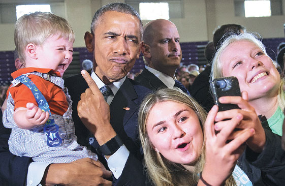 Us President Barack Obama Holds 10 Month Old Brooks Breitwieser