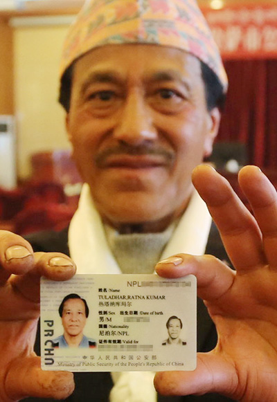 Foreigners in Tibet 'really happy' to be given green cards
