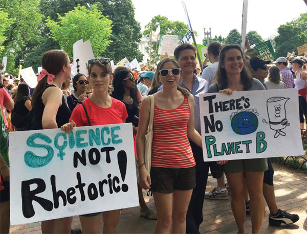 Thousands march in heat of Washington to advocate for climate