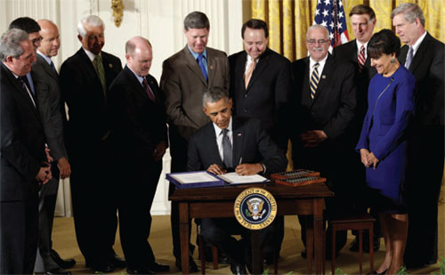 Obama signs trade bill into law