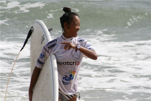 Female surfer rides China's waves