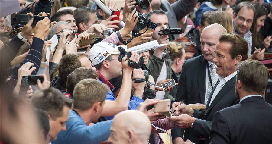 Arnold Schwarzenegger takes selfie with cast members in Berlin