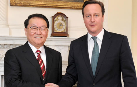 Senior CPC official meets British PM on ties