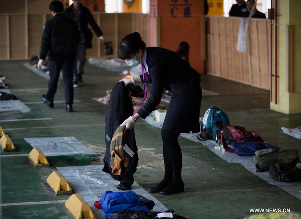 People claim belongings of victims of plane crash in Taipei