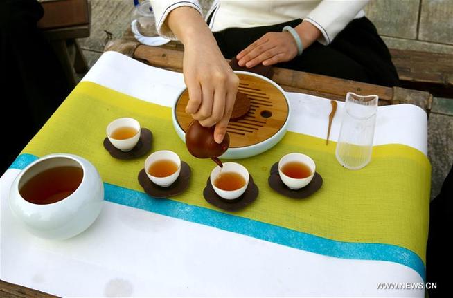 Girls perform tea ceremony at Wuyi Mountain in SE China