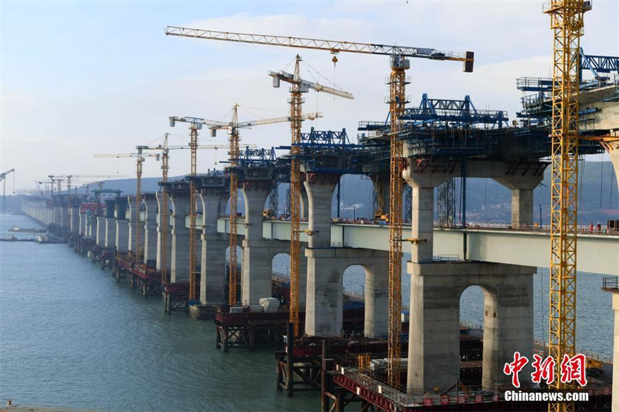 China's first cross-sea rail-road bridge takes shape