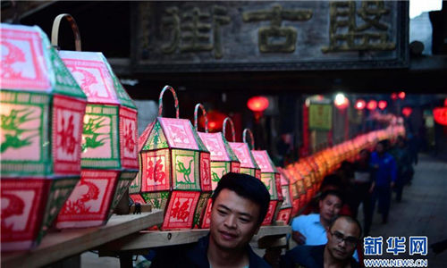 Lantern parade celebrates Lantern Festival in ancient village