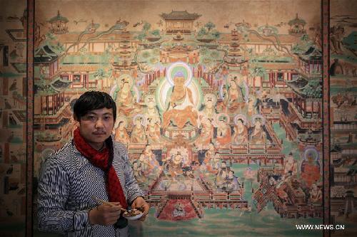 Rock-color paintings created in NW China's Dunhuang