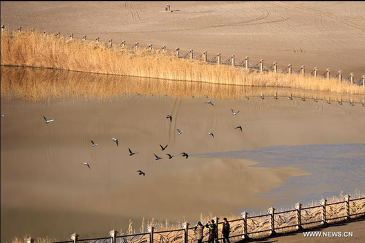 Scenery of crescent spring of Mingsha Hill in Dunhuang