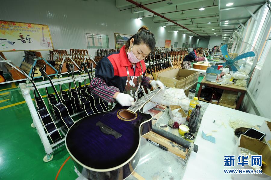 Guitar making aids poverty alleviation