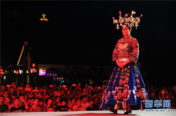 Foreign models showcase traditional Miao costumes in Guizhou
