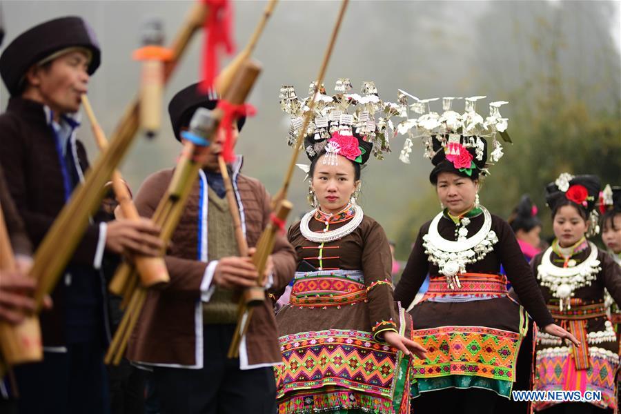 Miao people perform folk dance to celebrate Chinese Lunar New Year in China's Guizhou