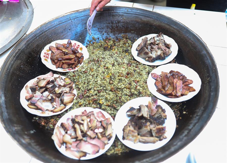 Villagers cook traditional food 